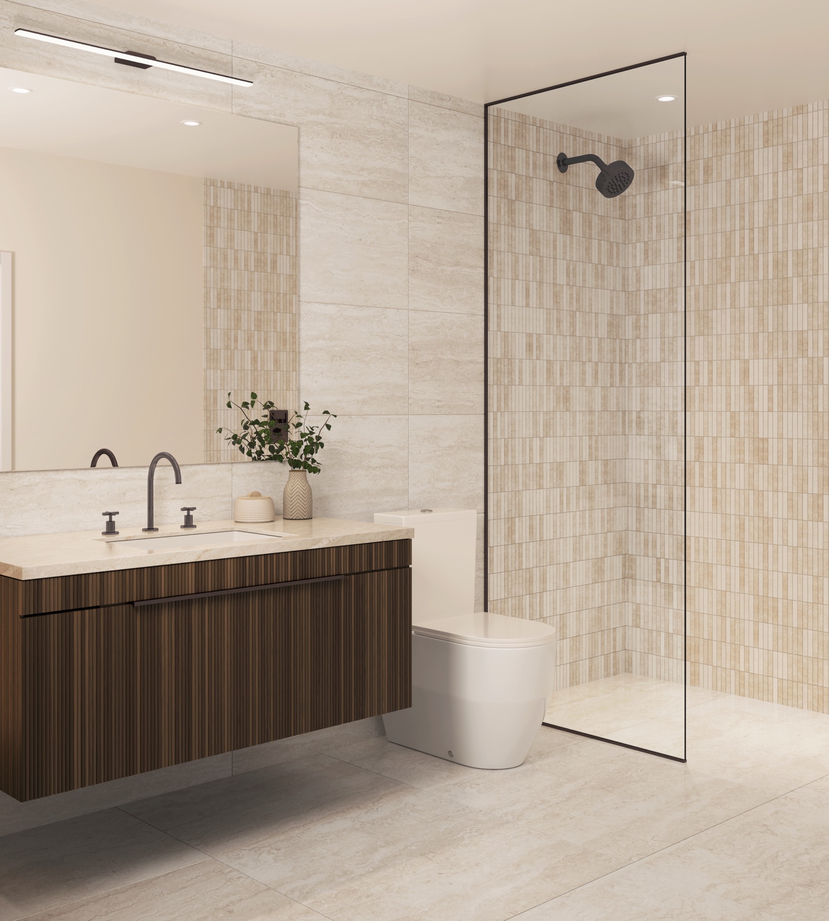 Spa-inspired primary bathroom at Seventeen Gables — a floating vanity, designer fixtures, and a curated palette of natural stone and warm-toned finishes.
